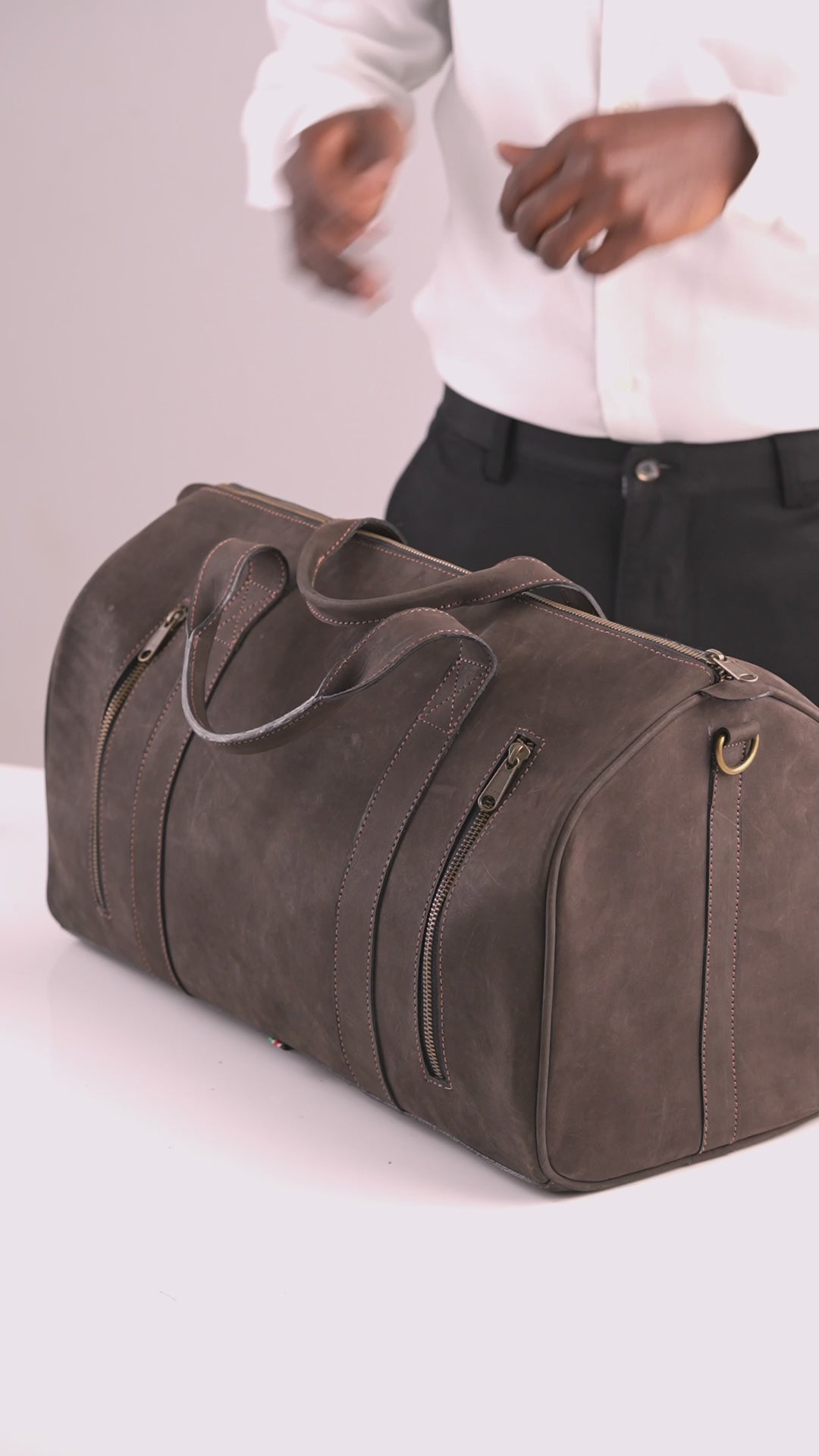 Mubi Leather craftsmanship: hand-finishing a leather travel bag